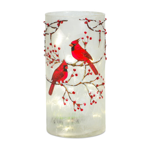 Bright red cardinals perched on berry covered branches - hygge cave