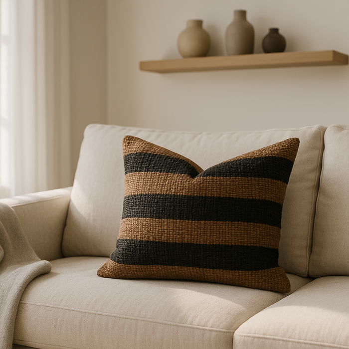 How to Style a Black and Tan Woven Pillow for Warmth and Texture