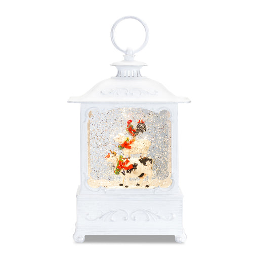 piece features stacking farm animals inside of a lantern-shaped snow globe - hygge cave