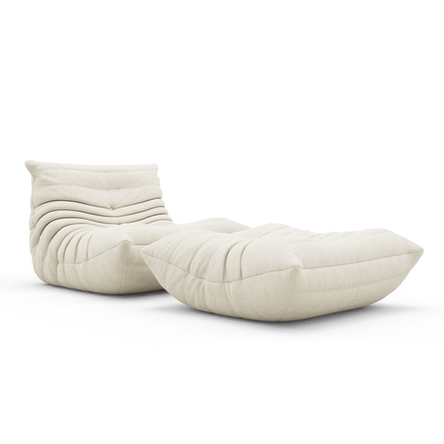 A soft and durable lounge bean bag chair with a matching ottoman for added comfort.