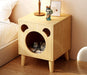 Stay organized and stylish with this cute nightstand that doubles as a comfortable cat house.