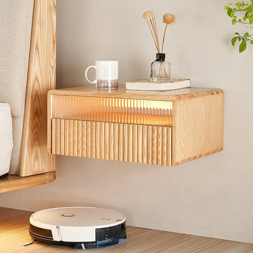 Add a touch of elegance and functionality to your bedroom with this suspended wooden bedside table.