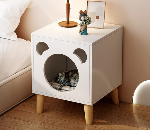 Provide your furry friend with a cozy place to sleep and keep your bedroom organized with this cute cat house nightstand.