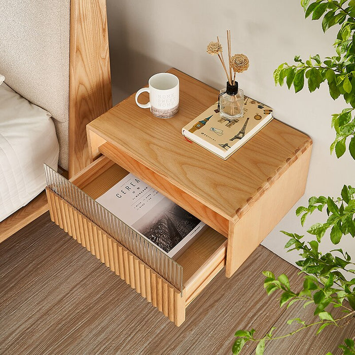 Make a statement with this sophisticated and functional suspended wooden bedside table, perfect for any contemporary bedroom.