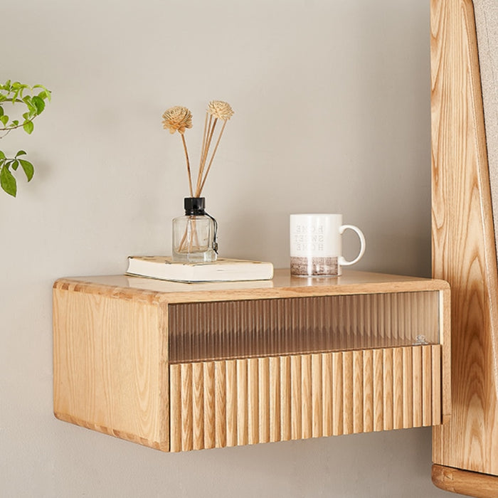 Maximize space and minimize clutter with this unique and innovative suspended wooden bedside table.