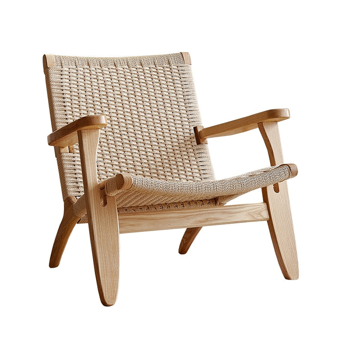 A lightweight and comfortable rattan chair with a contemporary design and cushioned seat, available in natural wood or walnut.