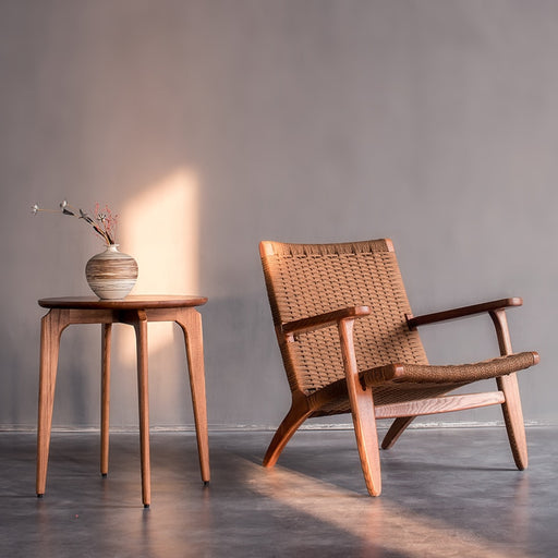 A comfortable and durable rattan chair with a contemporary design available in walnut color