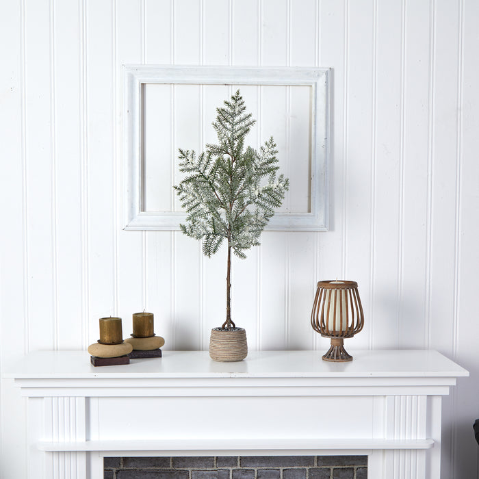 edgy Christmas tree in a decorative planter- hygge cave